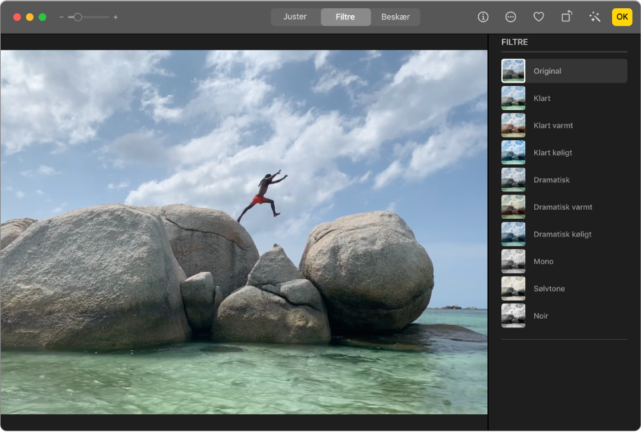 Et videoklip i redigeringsoversigten med Filtre valgt øverst i Fotos-vinduet og vinduet Filtre med filtreringsmuligheder.