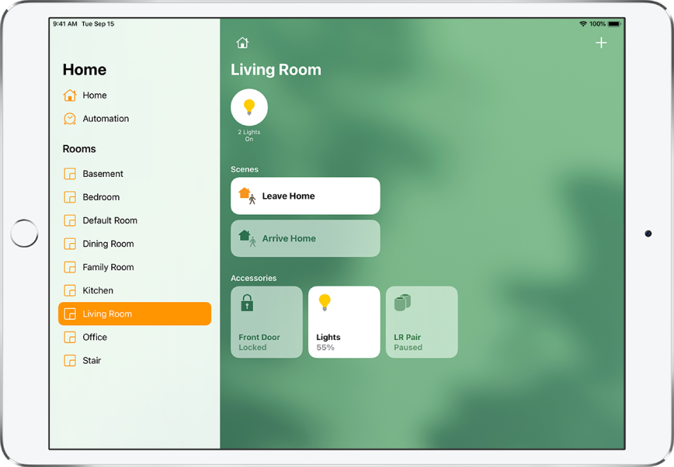 The Home app with the sidebar on the left. Living Room is highlighted in the sidebar. To the right is a status button for two lights near the top, two scenes below, and three accessory buttons near the bottom.