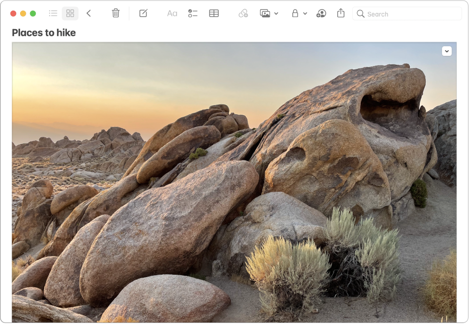 A note that includes a large photo of a rocky landscape.