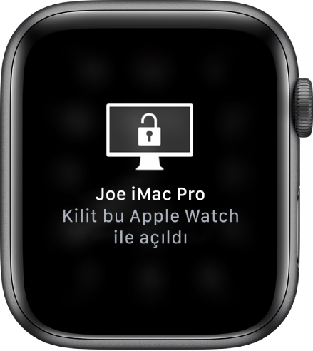 “Can’ın iMac Pro’su kilidi bu Apple Watch tarafından açıldı” iletisini gösteren Apple Watch ekranı.