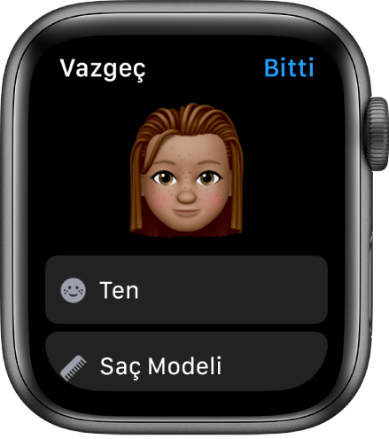Apple Watch’taki Memoji uygulaması üst tarafta bir yüz ve onun altında Ten Rengi ve Saç Stili seçeneklerini gösteriyor.