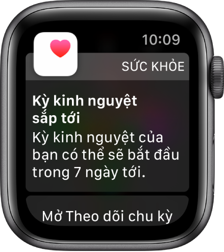 Apple Watch đang hiển thị một màn hình dự đoán chu kỳ có nội dung: “Kỳ kinh nguyệt sắp tới. Kỳ kinh nguyệt của bạn có thể sẽ bắt đầu trong 7 ngày tới”. Một nút Mở Theo dõi chu kỳ xuất hiện ở dưới cùng.