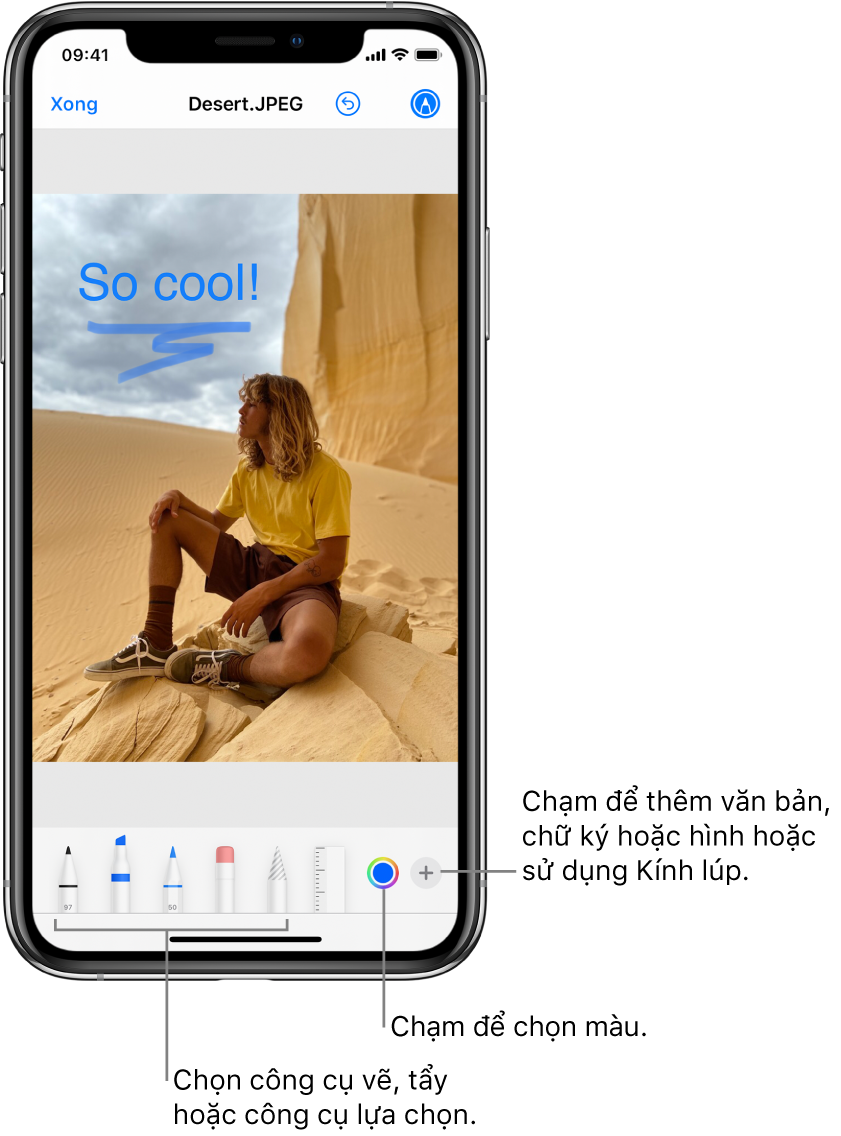 Một hình ảnh đang được sửa bằng Đánh dấu. Bên dưới hình ảnh, từ trái sang phải, là các nút cho công cụ Đánh dấu: bút vẽ, tẩy, công cụ chọn, màu và các nút thêm hộp văn bản, chữ ký của bạn và hình dạng cũng như để chọn Kính lúp.