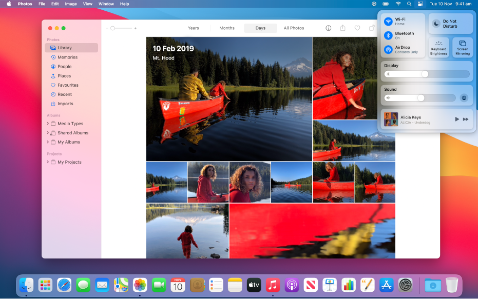 The Photos app open and ready to share photos using Screen Mirroring from Control Centre, located in the top-right corner of the desktop.