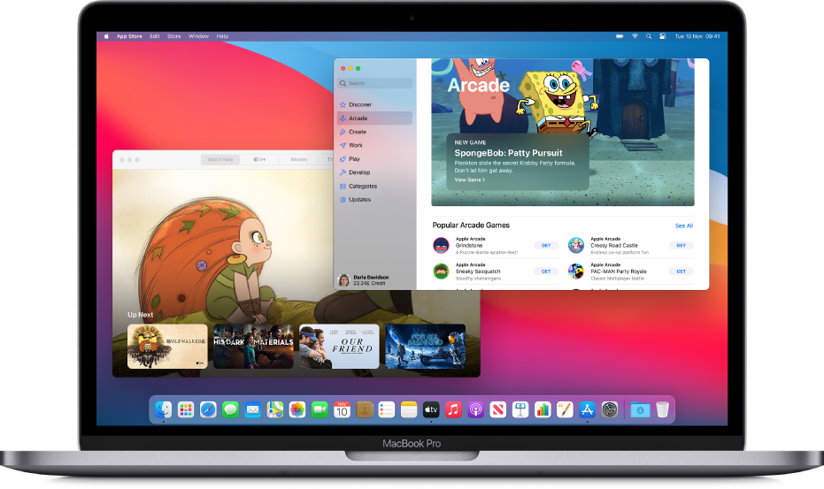 A Mac desktop with the Apple TV app showing the Watch Now screen and the App Store app showing Apple Arcade.