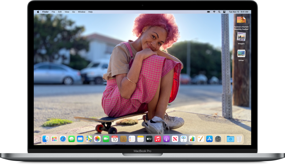 A Mac desktop showing a customized desktop picture, with the Dock along the bottom of the screen and several documents along the right edge of the screen.