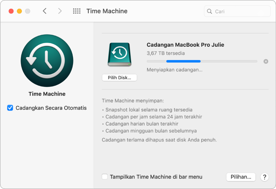 Preferensi Time Machine menampilkan status kemajuan pencadangan ke drive eksternal.