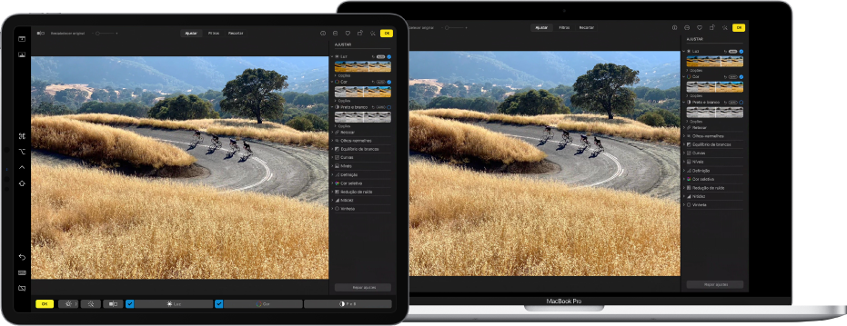 Um iPad Pro junto a um MacBook Pro. A secretária do Mac mostra uma fotografia a ser editada na aplicação Fotografias. O iPad Pro mostra a mesma fotografia, assim como a barra lateral Sidecar na extremidade esquerda do ecrã e a Touch Bar do Mac na parte inferior do ecrã.