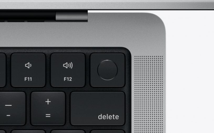 Animasi melihat ke bawah ke arah tombol function MacBook Pro, berhenti di tiga tombol function khusus: F4 Spotlight, F5 Dikte/Siri, dan F6 Jangan Ganggu.