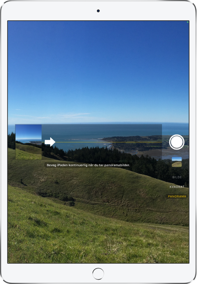 Kamera i panoramamodus. En pil til venstre for midten peker mot høyre for å vise panoreringsretningen.