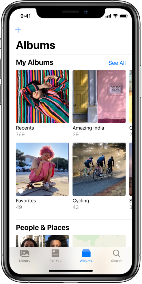 The Albums tab at the bottom of the screen is selected. Under the My Albums heading, the screen is populated with the albums Recents, Amazing India, Favorites, and Cycling. Next to the My Albums heading is the See All button. In the top-left corner of the screen is the add button.