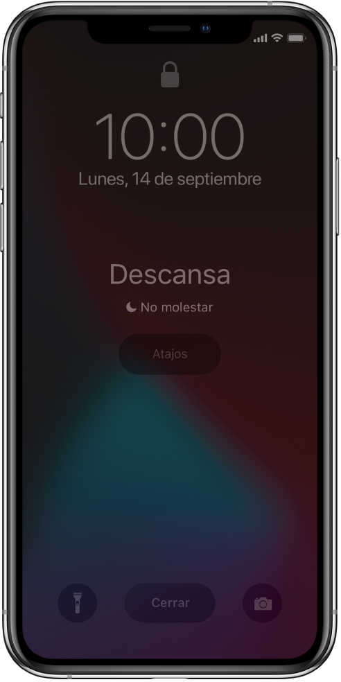 Pantalla del iPhone que muestra Descansa y “‘No molestar’ está activado” en el centro. Debajo de eso está el botón Atajos. En la parte inferior de la pantalla, de izquierda a derecha, se encuentran los botones Linterna, Cerrar y Cámara.