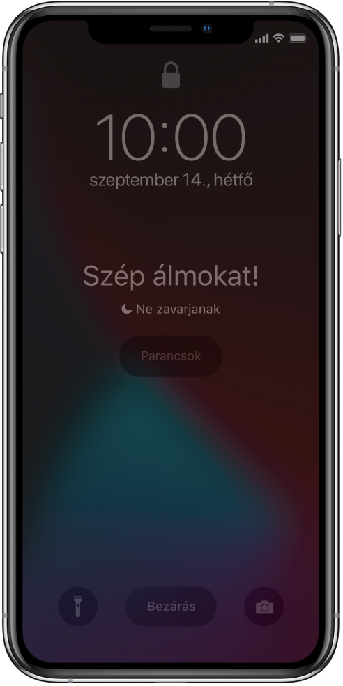 Az iPhone képernyője, amelynek közepén a „Szép álmokat!" és „A Ne zavarjanak funkció be van kapcsolva" felirat látható. Alattuk a Parancsok gomb jelenik meg. A képernyő alján balról jobbra haladva a Zseblámpa, a Bezárás és a Kamera gomb látható.