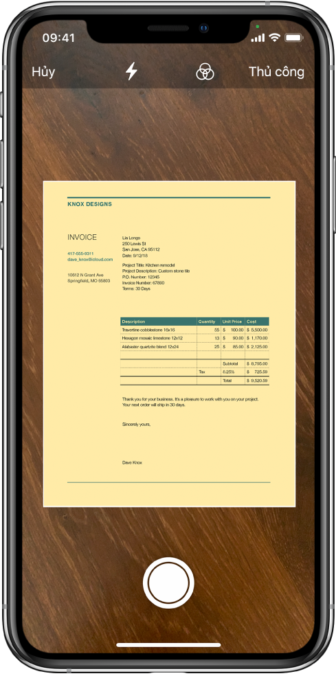 Màn hình hiển thị một tài liệu đang được quét. Nút Chụp ảnh nằm ở giữa phía dưới cùng.