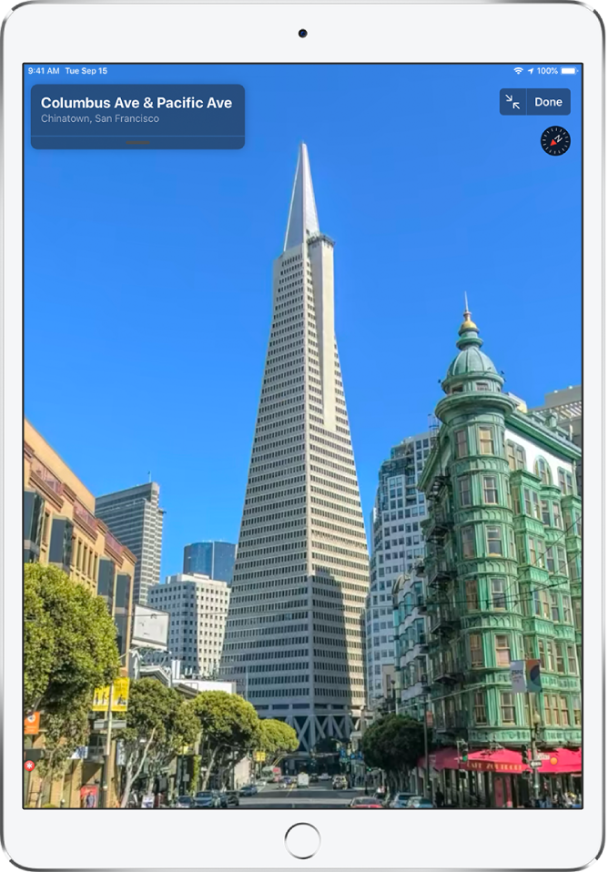 A full-screen view of a street leading to the Transamerica Pyramid building.