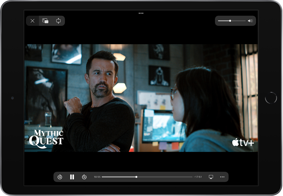 A movie playing, with playback controls showing. The Close, Picture in Picture, and Zoom buttons are at the top left. The volume slider is at the top right. At the bottom left, there are buttons to skip 15 seconds backward, pause, and skip 15 seconds forward. Across the bottom center is a slider that you can drag to adjust the video position; the elapsed time and time remaining appear on either side of the slider. At the bottom right, there are buttons to change the video destination and show more controls.
