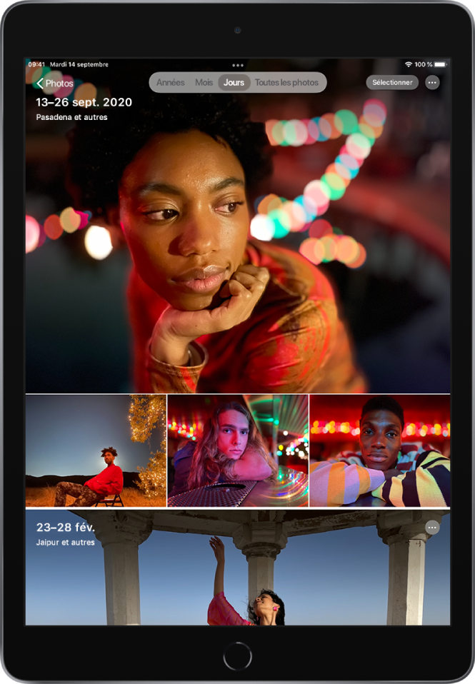 La présentation Jours de la photothèque est affichée. Une sélection de vignettes de photos remplit l’écran. Dans le coin supérieur gauche de l’écran se trouve le bouton Photos, permettant d’ouvrir la barre latérale. Sous le bouton Photos se trouvent la date et le lieu des photos affichées à l’écran. En haut au centre se trouvent des options pour parcourir les photos par Années, Mois, Jours ou « Toutes les photos ». L’option Jours est sélectionnée. En haut à droite de l’écran se trouvent les boutons Sélectionner et Plus.