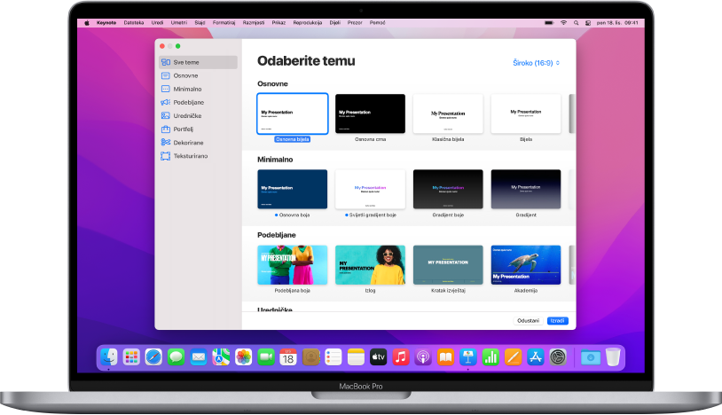 MacBook Pro s otvorenim izbornikom tema aplikacije Keynote na zaslonu. Kategorija Sve teme odabrana je s lijeve strane, a postojeće teme pojavljuju se s desne u recima po kategoriji. Skočni izbornik Jezik i Regija u donjem lijevom kutu i skočni izbornik Standardno i Široko u gornjem desnom kutu.