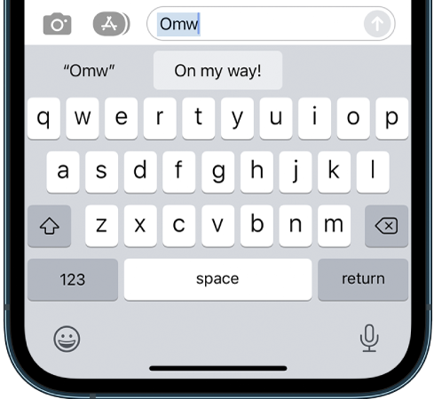 A message with the text shortcut OMW typed and the phrase “On my way!” suggested below as replacement text.