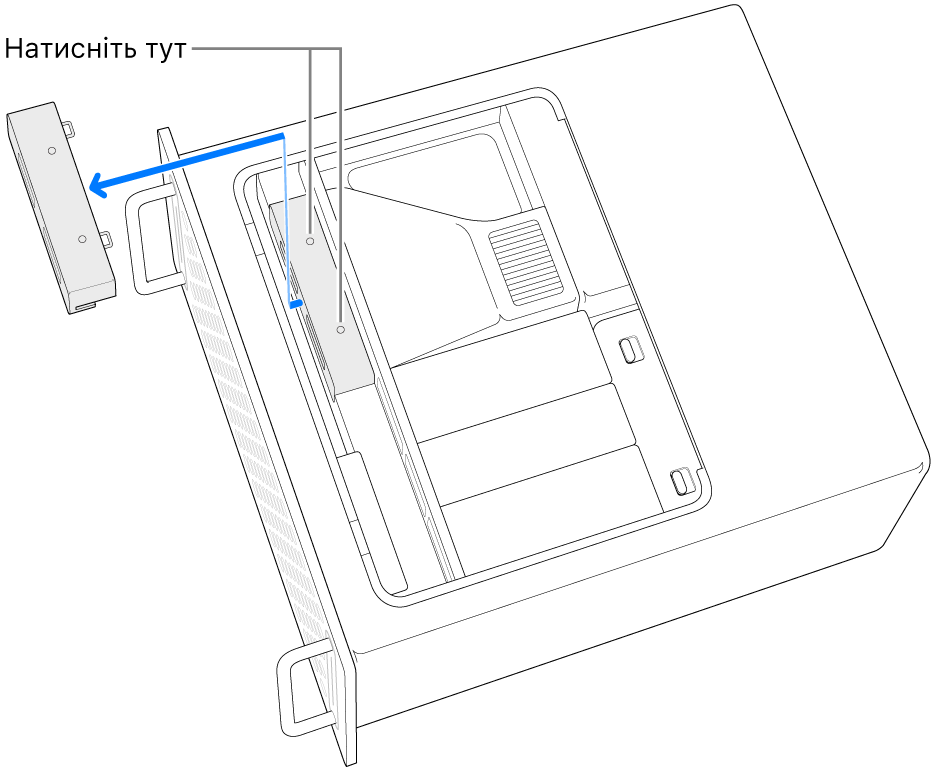 Mac Pro, покладений на бік, ілюстрація того, де натиснути, щоб зняти кришку SSD.