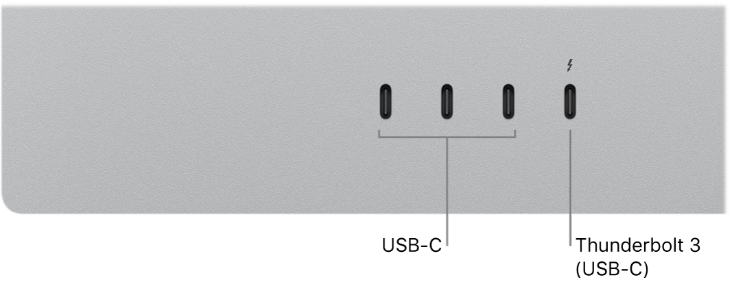Detail zadní strany monitoru Studio Display se třemi USB‑C porty na levé a jedním portem Thunderbolt 3 (USB‑C) na pravé straně.