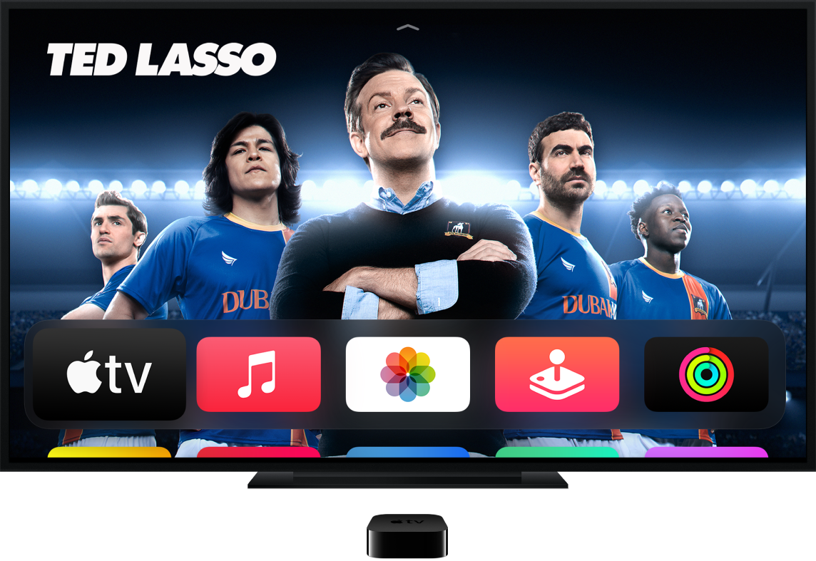 Apple TV conectado a una televisión donde se muestra la pantalla de inicio