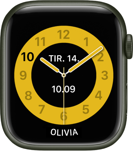 Urskiven Skoletid, som viser et analogt ur med datoen og den digitale tid omkring midten. Navnet på den person, der bruger uret, er vist forneden.
