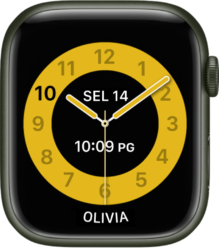 Jam Waktu Sekolah menunjukkan jam analog dengan tarikh dan masa digital berhampiran bahagian tengah. Nama orang yang menggunakan jam di bahagian bawah.