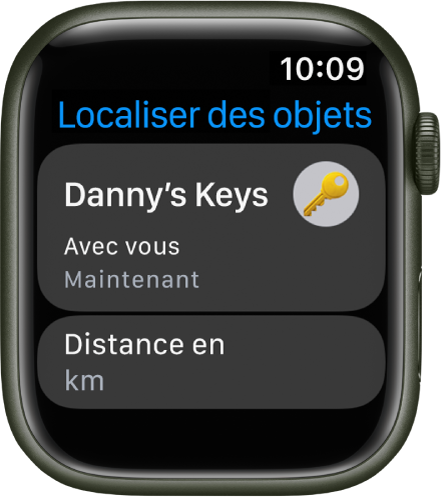 L’app Localiser des objets indiquant que le AirTag fixé à un jeu de clés se trouve sur vous. Le bouton « Distance en kilomètres » figure en dessous.
