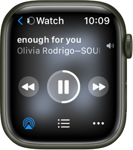 „Now Playing“ ekranas, kurio viršuje kairėje rodomas „Watch“ su į kairę nukreipta rodykle, kurią paspaudus atidaromas įrenginio ekranas. Toliau rodomas dainos pavadinimas ir atlikėjo vardas. Leidimo valdikliai yra viduryje. „AirPlay“, garso takelių sąrašas ir papildomų parinkčių mygtukai rodomi ekrano apačioje.