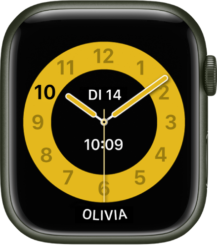 De wijzerplaat Schooltijd, waarop een analoge klok te zien is met de datum en in het midden de digitale tijd. Onderin zie je de naam van degene die het horloge gebruikt.