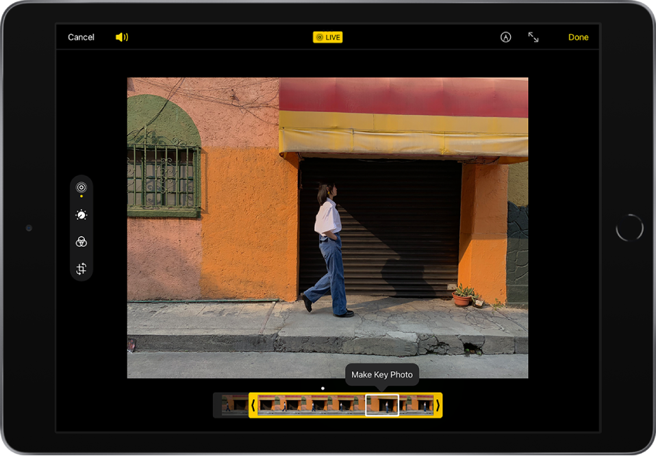 A Live Photo is in the center of the Edit screen. The Live Photo frame viewer is at the bottom of the screen. The Cancel and Volume buttons are in the top-left corner, the Live Photo button is in the top center, and the Mark Up, Enter Full Screen and Done buttons are in the top-right corner. The editing tools are on the left side of the screen: from the top to bottom, Live Photo, Adjust, Filters, and Crop. Live Photo is selected.