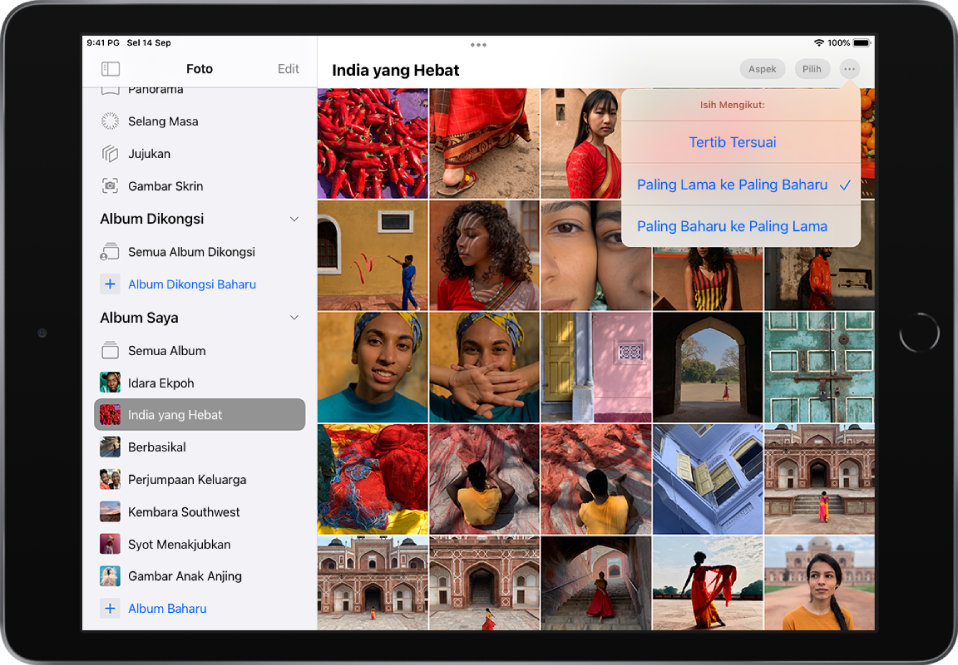Bar sisi Foto dibuka di sebelah kiri skrin. Di bawah tajuk Album Saya, album bertajuk India Hebat dipilih. Baki skrin menunjukkan imej kecil foto daripada album dalam grid. Di penjuru kanan atas skrin, butang Lagi dipilih dan pilihan Isih Ikut ditunjukkan: Tertib Tersuai, Paling Lama ke Paling Baharu atau Paling Baharu ke Paling Lama. Paling Lama ke Paling Baharu dipilih.
