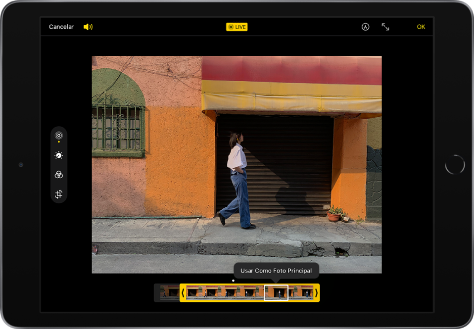 Uma Live Photo está no centro da tela Editar. O visualizador de fotogramas da Live Photo está na parte inferior da tela. Os botões Cancelar e Volume estão no canto superior esquerdo, o botão Live Photo está na parte superior central, e os botões Marcação, Entrar em Tela Cheia e OK estão no canto superior direito. As ferramentas de edição estão no lado esquerdo da tela: de cima para baixo, Live Photo, Ajustar, Filtros e Recortar. Live Photo está selecionado.