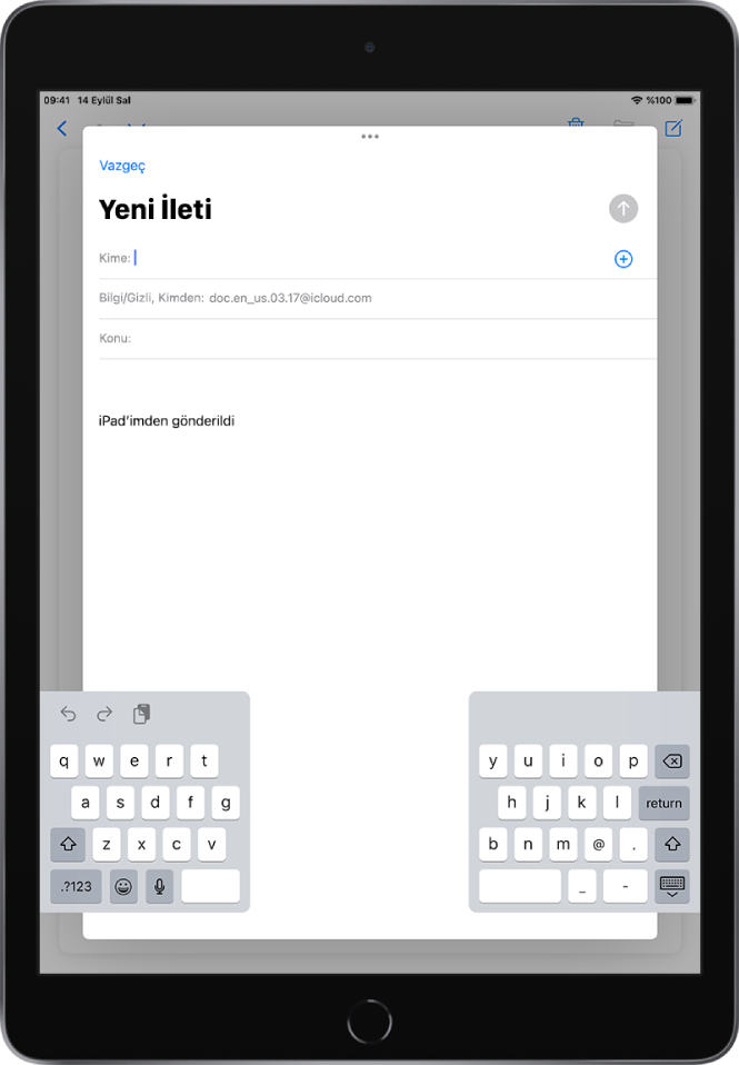 iPad ekranının en altından ayrılmış ve yeri değiştirilmiş klavye ile yeni bir e-posta iletisi oluşturuluyor.