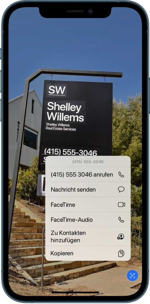Ein Foto füllt den gesamten Bildschirm aus. Im Foto ist ein Schild mit Text und einer Telefonnummer zu sehen. Die Telefonnummer ist ausgewählt und es stehen die folgenden Optionen zur Verfügung: „Anrufen“, „Nachricht senden“, „FaceTime“, „FaceTime-Audio“, „Zu Kontakten hinzufügen“ und „Kopieren“.