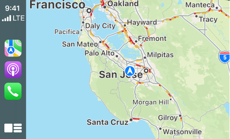 CarPlay showing icons for Maps, Podcasts, and Phone on the left and a map of the current area on the right.