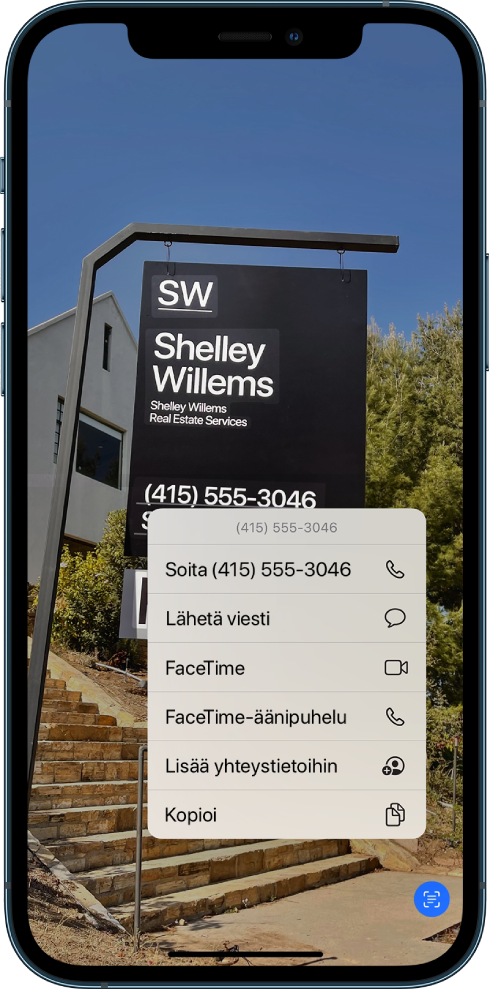 Valokuva on avattu koko näyttöön. Kuvassa on kyltti, jossa on tekstiä ja puhelinnumero. Puhelinnumero on valittuna, ja näytössä näkyy seuraavat vaihtoehdot: Soita, Lähetä viesti, FaceTime, FaceTime-äänipuhelu, Lisää yhteystietoihin ja Kopioi.