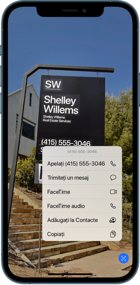 O poză este deschisă pe întregul ecran. În cadrul pozei se află un anunț care include text și un număr de telefon. Numărul de telefon este selectat și următoarele opțiuni sunt disponibile pe ecran: Apelați, Trimiteți mesaj, FaceTime, FaceTime audio, Adăugați la contacte și copiați.