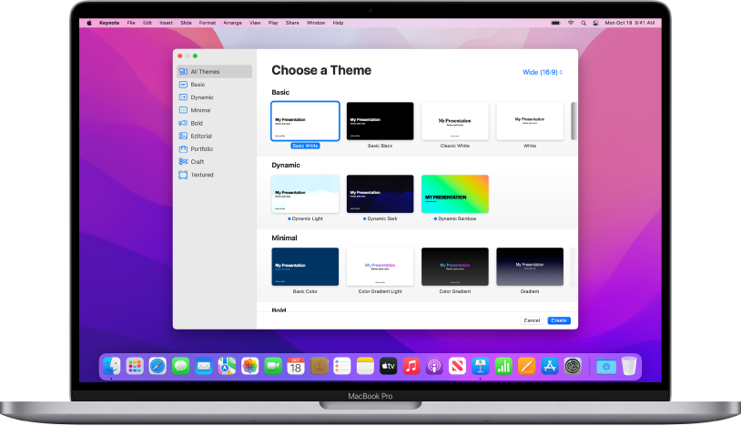 A MacBook Pro with the Keynote theme chooser open on the screen. The All Themes category is selected on the left and predesigned themes appear on the right in rows by category. The Language and Region pop-up menu is in the bottom-left corner and the Standard and Wide pop-up menu is in the top-right corner.