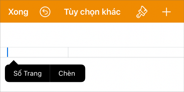 Cửa sổ Thiết lập tài liệu với dấu chèn trong trường đầu trang và menu bật lên có hai mục menu: Số trang và Chèn.