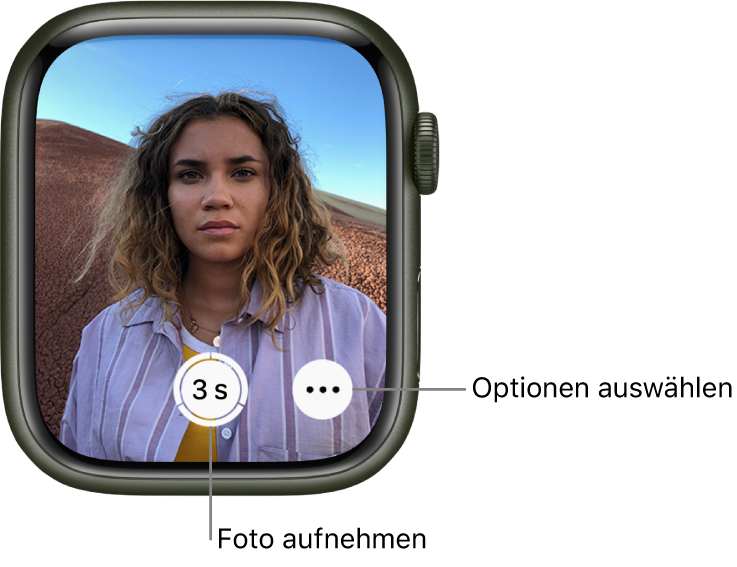 Die Apple Watch wird als Kamerafernbedienung verwendet. Auf dem Display ist das Kamerabild des iPhone zu sehen. Die Taste „Bild aufnehmen“ befindet sich unten in der Mitte und die Taste „Weitere Optionen“ rechts davon. Wenn du ein Foto aufgenommen hast, befindet sich unten links die Taste zum Anzeigen des Fotos.