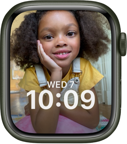 The Portraits watch face shows a photo from your synced photo album. The date and time is in the lower third of the screen.
