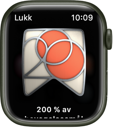 Det vises en utmerkelse på Apple Watch. Det vises en beskrivelse av utmerkelsen under den. Du kan dra for å snu på merket.