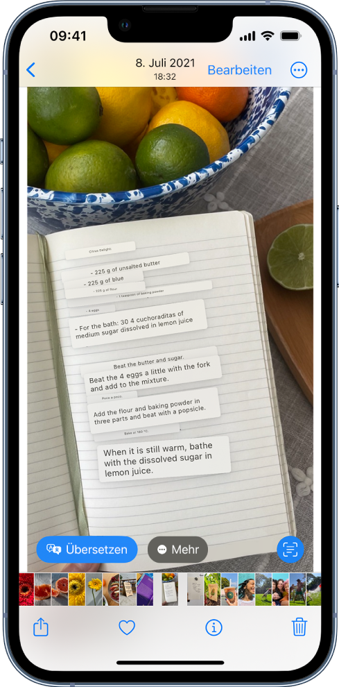 Ein Foto wird im Vollbildmodus angezeigt. Im Foto befindet sich übersetzter Text. Unten auf dem Bildschirm sind die Tasten „Übersetzen“, „Währungsumrechnung“ und „Mehr“. Die Taste „Übersetzen“ ist ausgewählt.