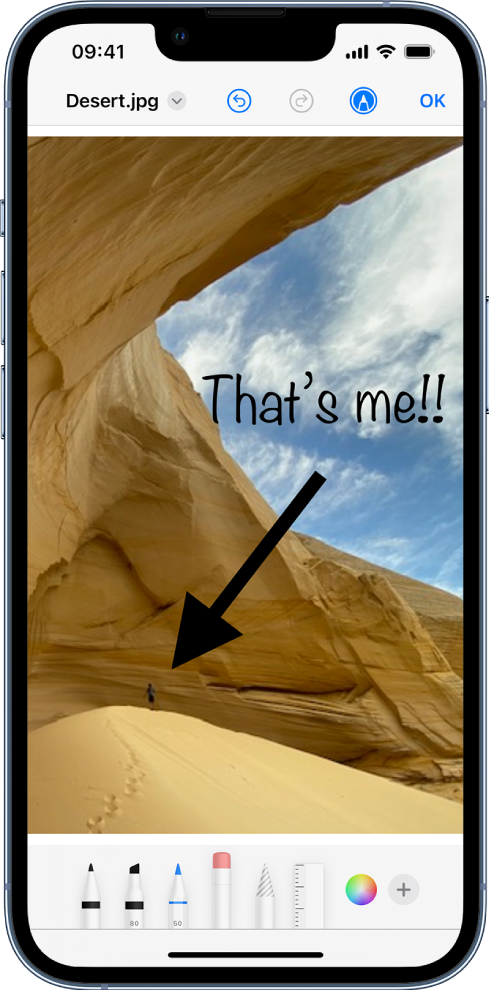 Uma imagem a ser editada com Marcação. Por baixo da imagem, da esquerda para a direita, encontram‑se os botões das ferramentas de marcação: canetas de desenho, borracha, ferramenta de seleção, cores, botões para adicionar uma caixa de texto, a sua assinatura e formas, e para escolher a lupa.