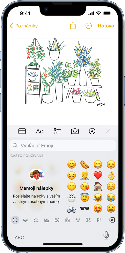 Poznámka upravovaná v apke Poznámky s otvorenou klávesnicou emoji a poľom Hľadať emoji v hornej časti obrazovky.