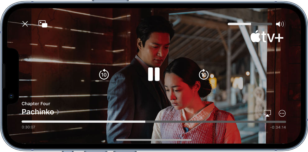 En TV-serie spelas och reglage visas. Överst till vänster finns knapparna Stäng och Bild-i-bild. Överst till höger finns volymreglaget. I mitten finns knappar för att hoppa 10 sekunder bakåt, pausa och hoppa 10 sekunder framåt. Längst ned i mitten finns ett reglage för att justera videopositionen. På vardera sidan av reglaget visas förfluten tid och återstående tid. Längst ned till höger finns knappar för att ändra videomål och visa fler reglage.