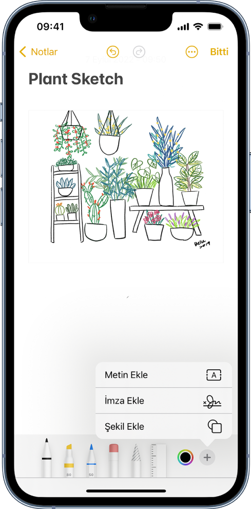 Notlar uygulamasında bir mutfak tadilatının şeması işaretleniyor. Ekranın en altında çizim araçlarını ve renk seçiciyi içeren İşaretle araç çubuğu görünüyor. Metin, açıklama, imza, büyüteç ve şekil ekleme seçeneklerini içeren bir menü sağ alt köşede görünüyor.