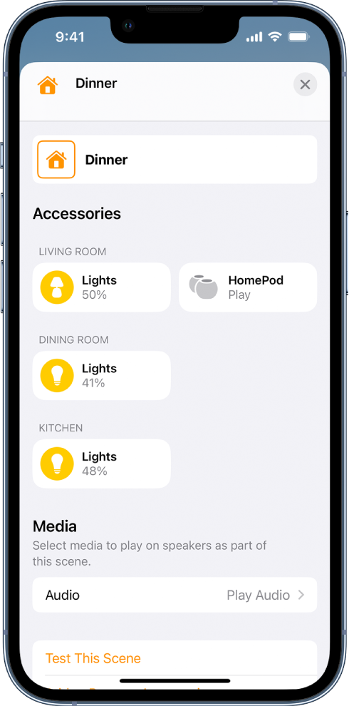 A scene editing screen in the Home app. The name of the scene is at the top of the screen. Below are three rooms and the accessories that have been added to each room as part of the scene. Near the bottom of the screen is a Media section where a HomePod in the living room has been set up to play audio. A Test This Scene button is at the bottom of the screen.